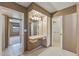 Bedroom vanity includes a large mirror, built-in cabinets, and ample lighting at 10449 W Tropicana Cir, Sun City, AZ 85351