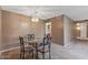 Charming dining area with a glass-top table and stylish chandelier, perfect for intimate meals at 10449 W Tropicana Cir, Sun City, AZ 85351
