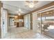 The dining area has tile floors and leads to a kitchen with sliding door access to the patio at 10449 W Tropicana Cir, Sun City, AZ 85351