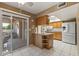 The dining area provides access to the kitchen and a patio with sliding door access at 10449 W Tropicana Cir, Sun City, AZ 85351