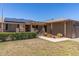 Charming single-story home featuring desert landscaping, solar panels, and a cozy pergola-covered patio at 10449 W Tropicana Cir, Sun City, AZ 85351