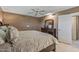 Comfortable main bedroom showcasing a king-size bed and dresser with a mirror at 10449 W Tropicana Cir, Sun City, AZ 85351