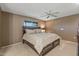 Serene main bedroom featuring a comfortable king-size bed and neutral decor at 10449 W Tropicana Cir, Sun City, AZ 85351