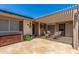 Private patio with stone flooring, comfortable seating, and a pergola for shade at 10449 W Tropicana Cir, Sun City, AZ 85351
