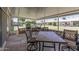 Enclosed patio boasts tile flooring and ample seating for outdoor dining or relaxation at 10449 W Tropicana Cir, Sun City, AZ 85351
