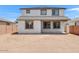 Backyard view of the two story home with a blank canvas ready for landscaping at 10912 E Tiburon Ave, Mesa, AZ 85212