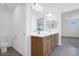 Bright bathroom featuring a dual sink vanity with modern fixtures and a large mirror at 10912 E Tiburon Ave, Mesa, AZ 85212