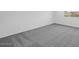 Spacious bedroom featuring gray carpet flooring, white walls, and a window at 10912 E Tiburon Ave, Mesa, AZ 85212