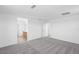 Open bedroom with gray carpet leading to an en-suite bathroom with double sinks at 10912 E Tiburon Ave, Mesa, AZ 85212