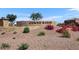 Stone Combe Ranch sign and monument with well-maintained landscaping and colorful flowering bushes at 10912 E Tiburon Ave, Mesa, AZ 85212