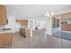 Open-concept kitchen and living area with stainless steel appliances, gray floors and center island at 10912 E Tiburon Ave, Mesa, AZ 85212