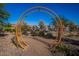 Community park with art installation, walking trails, and landscaping at 10912 E Tiburon Ave, Mesa, AZ 85212