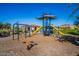 Community playground with slides, climbing structures, and swings at 10912 E Tiburon Ave, Mesa, AZ 85212