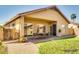 Staged backyard with furniture and patio, landscaping and mature plants at 11664 W Eagle Ct, Surprise, AZ 85378
