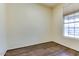 Cozy bedroom with a window offering natural light and wood floors throughout the space at 11664 W Eagle Ct, Surprise, AZ 85378