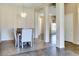Open dining room with chandelier lighting and tile floors at 11664 W Eagle Ct, Surprise, AZ 85378