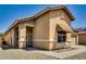 Single-story home with well-kept desert landscaping, covered entrance, and a two-car garage at 11664 W Eagle Ct, Surprise, AZ 85378