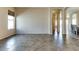 Living room featuring tile floors and a large window at 11664 W Eagle Ct, Surprise, AZ 85378
