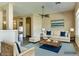 Staged living room boasts stylish furniture and decor at 11664 W Eagle Ct, Surprise, AZ 85378