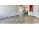 Spacious living room with tile floors and neutral color palette at 11664 W Eagle Ct, Surprise, AZ 85378
