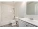 Bright bathroom with white vanity, tiled shower-tub combo, and modern fixtures at 1222 E Canyon Trl, San Tan Valley, AZ 85143
