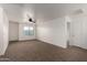 Large bedroom boasts neutral carpet, ceiling fan, and natural lighting at 1222 E Canyon Trl, San Tan Valley, AZ 85143