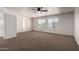 Spacious bedroom with neutral carpet, ceiling fan, and ample natural light at 1222 E Canyon Trl, San Tan Valley, AZ 85143