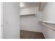 Walk-in closet featuring closet rods and neutral colored carpet at 1222 E Canyon Trl, San Tan Valley, AZ 85143