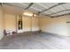 Spacious two-car garage ready for vehicles and storage, with water heater in view at 1222 E Canyon Trl, San Tan Valley, AZ 85143