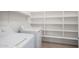 Efficient laundry room with washer, dryer, and shelving for storage at 1222 E Canyon Trl, San Tan Valley, AZ 85143
