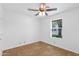 An empty bedroom featuring tile floors and a window overlooking the side yard at 1308 E Rosemonte Dr, Phoenix, AZ 85024