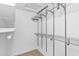 Walk-in closet featuring adjustable metal shelving, optimizing storage at 1308 E Rosemonte Dr, Phoenix, AZ 85024
