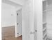 Bright hallway featuring an open door and a closet with shelving at 1308 E Rosemonte Dr, Phoenix, AZ 85024