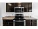 Kitchen featuring granite countertops and stainless steel appliances at 1308 E Rosemonte Dr, Phoenix, AZ 85024