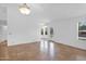 Bright living room featuring tile flooring, an ornamental light fixture, and windows offering natural light at 1308 E Rosemonte Dr, Phoenix, AZ 85024