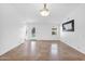 Bright living room featuring tile flooring, modern lighting, a ceiling fan and ample natural light at 1308 E Rosemonte Dr, Phoenix, AZ 85024