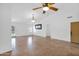 Bright living room with tile flooring, ceiling fan, modern lighting, and large windows for natural light at 1308 E Rosemonte Dr, Phoenix, AZ 85024