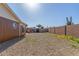 Side view of backyard featuring low maintenance landscaping and block fence for privacy at 1348 W Rockwood Dr, Phoenix, AZ 85027