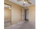 Bedroom features neutral carpet, window, tan walls, and mirrored closet at 1348 W Rockwood Dr, Phoenix, AZ 85027