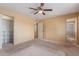 Spacious bedroom with walk-in closet and a view of an adjacent bathroom at 1348 W Rockwood Dr, Phoenix, AZ 85027