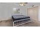 Carpeted bedroom featuring a grey bed frame at 1348 W Rockwood Dr, Phoenix, AZ 85027