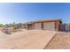 Charming single-story home featuring a two-car garage, solar panels, and low-maintenance landscaping at 1348 W Rockwood Dr, Phoenix, AZ 85027