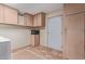 Laundry room has lots of cabinet space and a microwave at 1348 W Rockwood Dr, Phoenix, AZ 85027