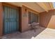 Features a shaded front porch with charming bench seating, offering a cozy welcome at 1348 W Rockwood Dr, Phoenix, AZ 85027