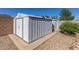 Spacious metal storage shed in backyard is perfect for storing tools and equipment at 1348 W Rockwood Dr, Phoenix, AZ 85027