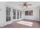 Sunroom with carpet, a ceiling fan, and French doors at 1348 W Rockwood Dr, Phoenix, AZ 85027