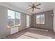 Sunroom with carpet, a ceiling fan and lots of windows at 1348 W Rockwood Dr, Phoenix, AZ 85027