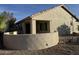 Private backyard featuring a cozy patio, desert landscaping, and a serene outdoor space for relaxation at 14878 W Verde Ln, Goodyear, AZ 85395