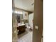 Bathroom with sink vanity, toilet and curtain-covered shower at 14878 W Verde Ln, Goodyear, AZ 85395