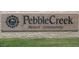 Close-up of the Pebble Creek Resort Community sign at 14878 W Verde Ln, Goodyear, AZ 85395